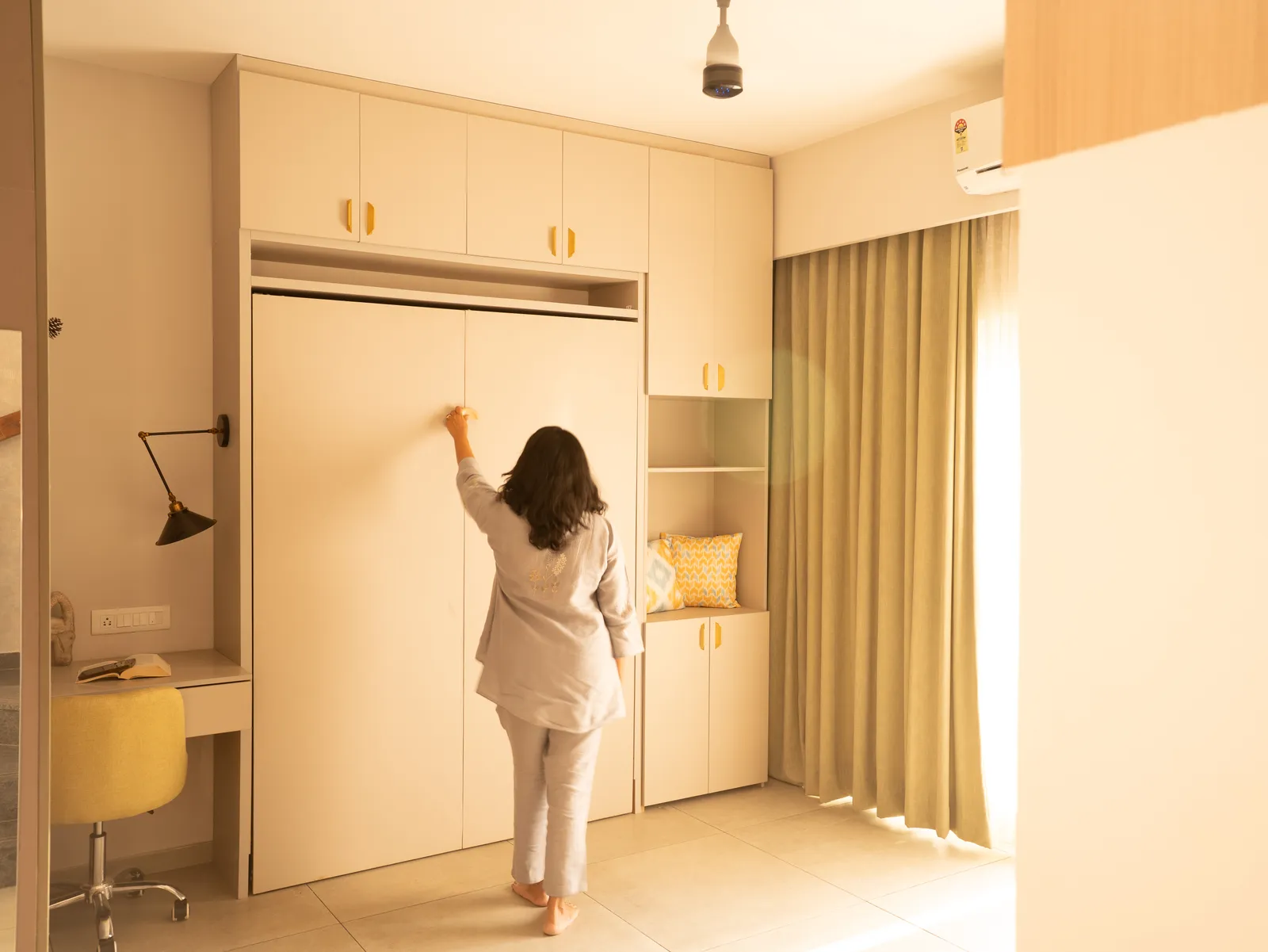 Wall bed cabinet being opened in the study — Amlan's Residence